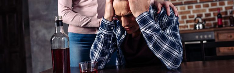 Drunk Man Sitting on Table Frustrated